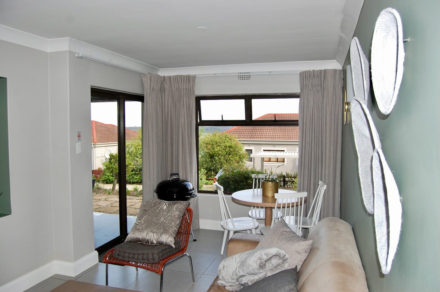 Living area opening onto the patio at 70A, Castleton, Plettenberg Bay